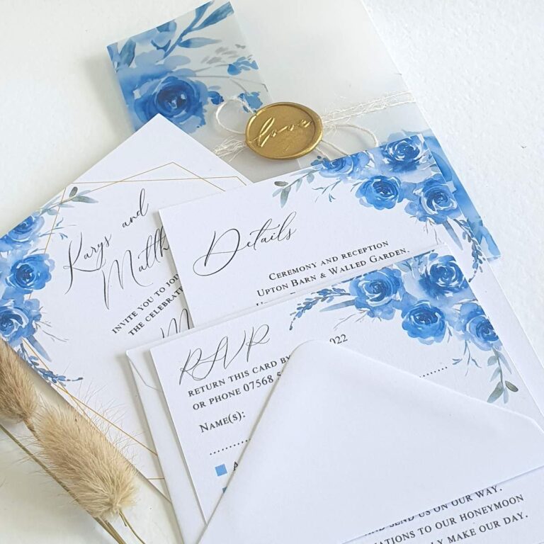 blue floral wedding invitation with vellum jacket and wax seal 768x768