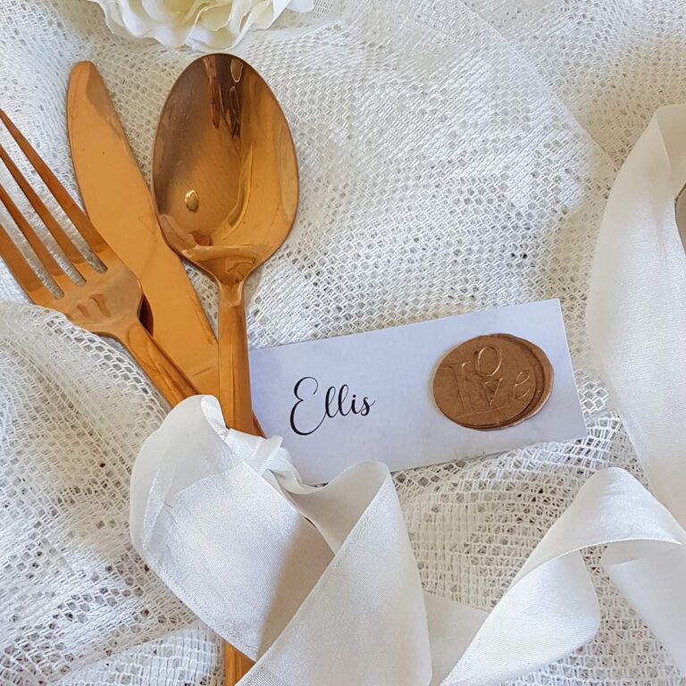 elegant wedding place tag with silk ribbon and gold wax seal 768x768